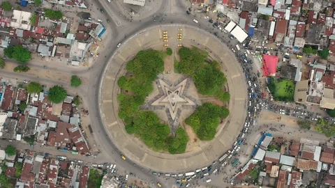 Benin from above : Cotonou Red Star place tilt up Stock-Footage 99418853