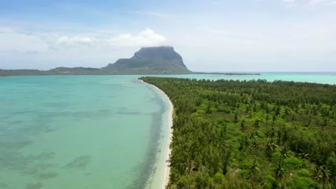 Benitier Island against the backdrop of Mount Le Morne on Mauritius Stock Footage 145256133