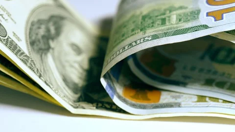 Benjamin Franklin on 100 dollar smiles sarcastically. Stock Footage 123829644