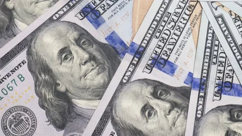 Benjamin Franklin one hundred dollars spinning in a circle closeup Stock Footage 229107114