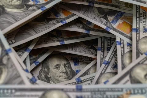 Benjamin Franklin portrait inside a swirling tunnel of US one hundred dolla.. Stock Photos