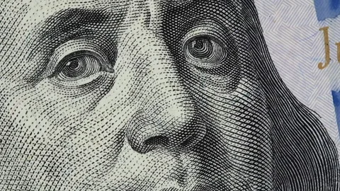 Benjamin Franklin on US 100 dollar bill slow rotating Video stock 101395570