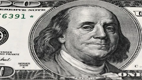 Benjamin Franklin on US 100 dollar bill tracking. Low angle, macro. 8K Stock Footage 124986249