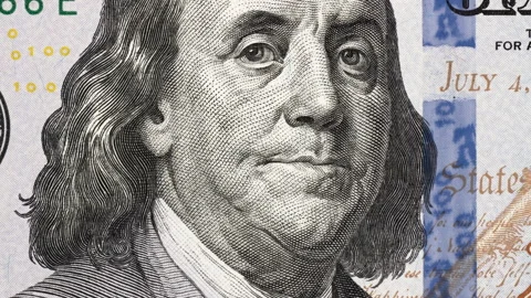 Benjamin Franklin on US 100 dollar bill tilting. Slider shot. 4K Stock Footage 150333515