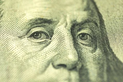 Benjamin Franklin's face on the US 100 dollar bill selective focus close-up p Stock Photos
