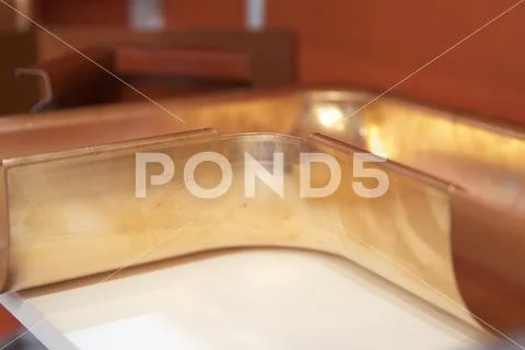 Bent copper profile for drainage system Stock Photos