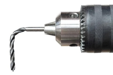 The bent drill bit in hand drilling-machine, close up view Stock Photos