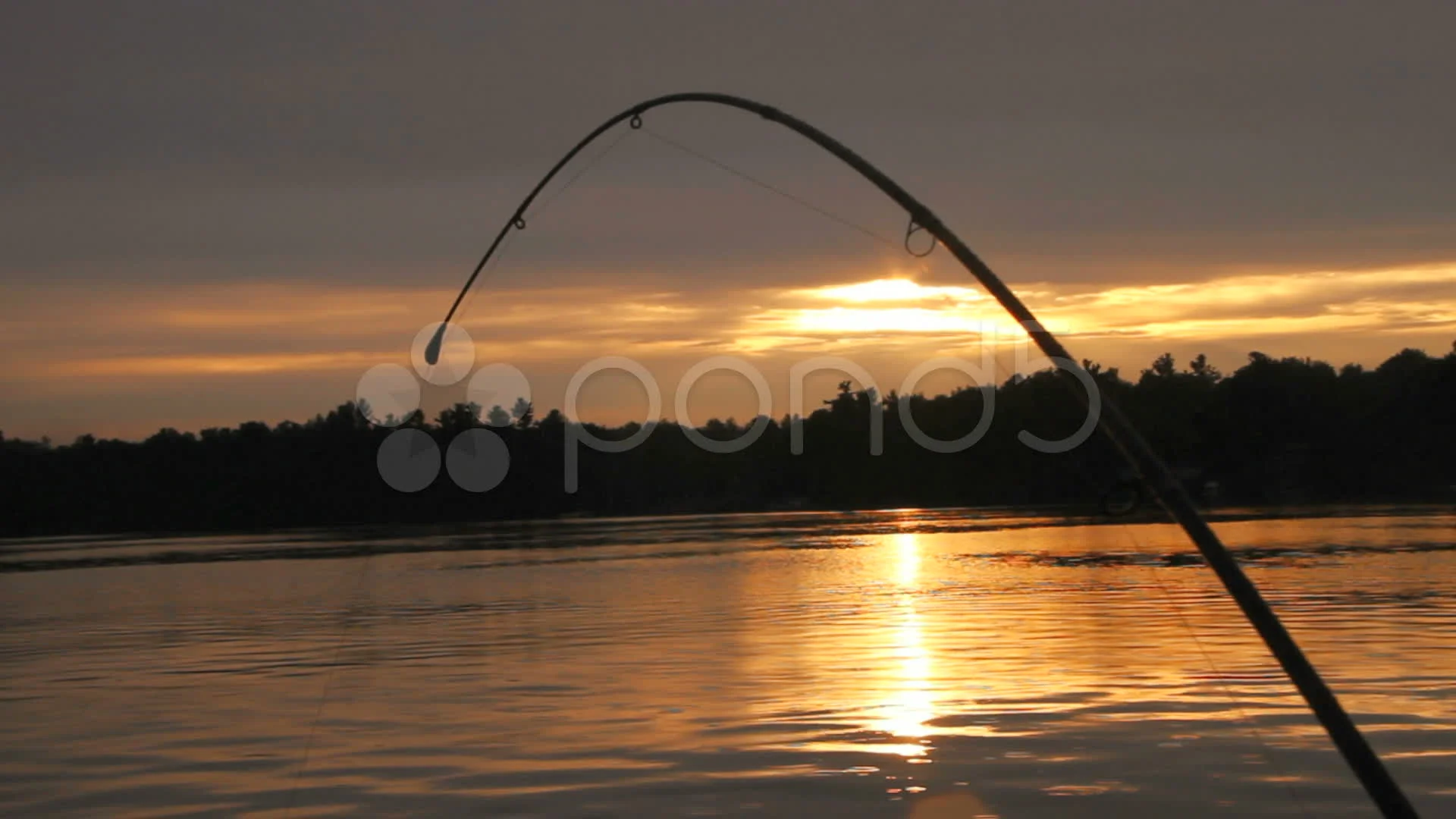Bent fishing rod at Sunset, Stock Video