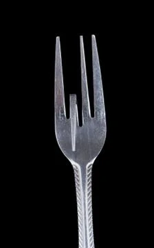 Bent metal fork, one teeth down. Stock Photos