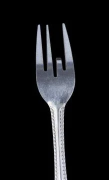 Bent metal fork, one teeth down. Stock Photos