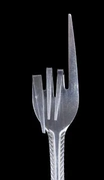 Bent metal fork, pointer. Stock Photos