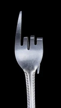 Bent metal fork, pointer. Stock Photos