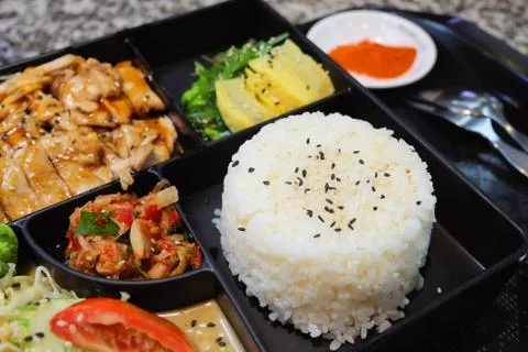 Bento Box or Multi-Layered Box with Teriyaki Chicken Stock Photos