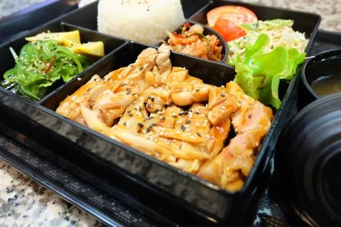 Bento Box or Multi-Layered Box with Teriyaki Chicken Stock Photos