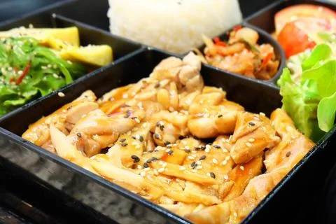 Bento Box or Multi-Layered Box with Teriyaki Chicken Stock Photos