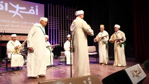 Berber Amazigh men dancing and playing playing Amazigh traditional instrument Stock Footage 296850935