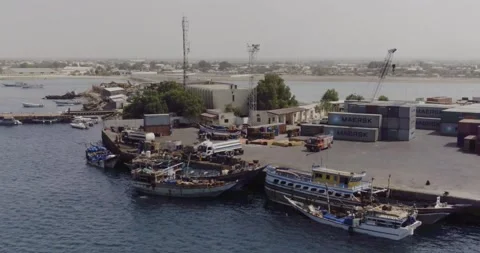 BERBERA PORT, SOMALILAND - Loading cargo to small boats Stock Footage 147436783