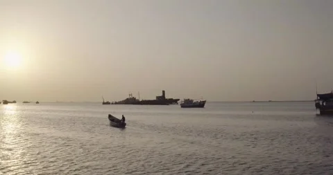 BERBERA, SOMALILAND - Sunset aerial shot of fisherman and wrecked ships Stock Footage