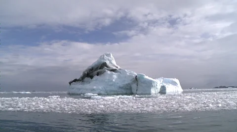 Berg in sunlight surrounded by brash ice, Antarctica Stock Footage 34313582