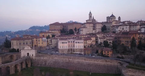 Bergamo, Italy. Drone aerial view of the old town during sunrise Stock Footage