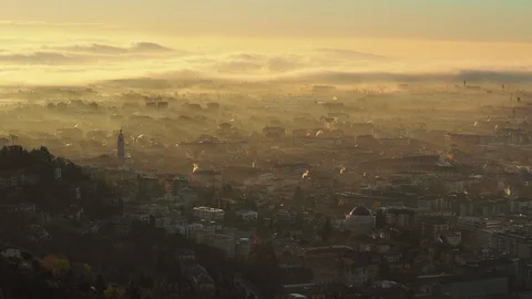 Bergamo, Italy. Time lapse the old town and the fog covers the plain at sunrise Stock Footage