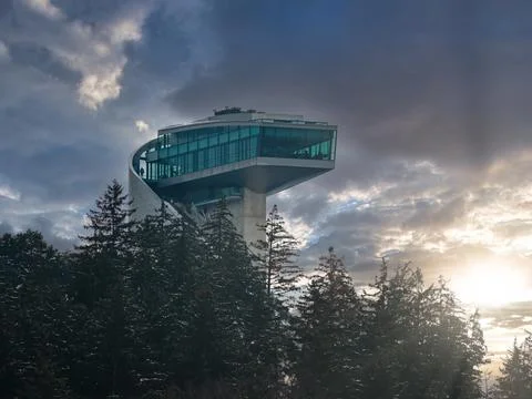 Bergisel Ski Jump tower and terrace in Innsbruck under late sun Stock Photos