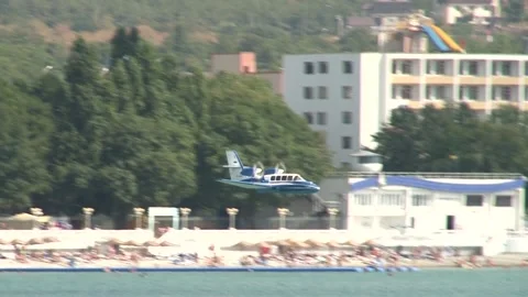 Beriev Be-103 - light amphibious aircraft (flying boat) plane lands on water. Stock Footage 130730004