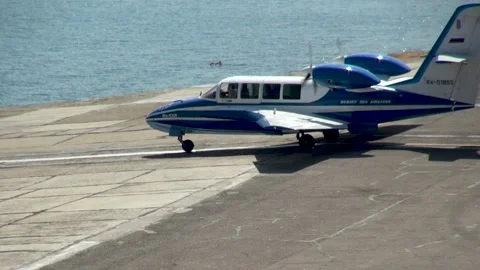 Beriev Be-103 - light amphibious aircraft moves from parking lot towards sea Stock Footage 134557235