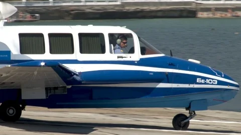 Beriev Be-103 Russian light amphibious aircraft is heading to sea for takeoff. Stock Footage 120777374