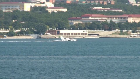 Beriev Be-103 Russian light amphibious aircraft.  floats like boat in sea. Stock Footage 120777391