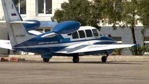 Beriev Be-103 Russian light amphibious aircraft.  moves to parking lot. Close-up Stock Footage 123635511