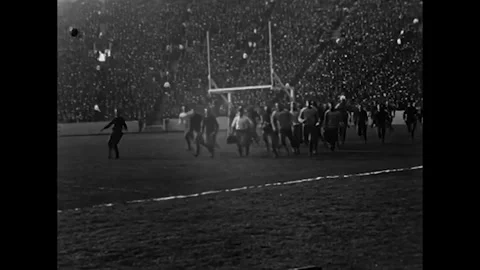 BERKELEY - 1923 - Spectators crowd California Memorial Stadium to watch a Stock Footage 340670327