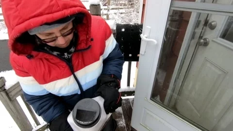 Berkeley Heights, NJ, USA - 02-13-2022 : woman salting the stairs Stock Footage 333598669