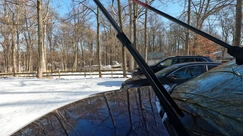 Berkeley Heights, NJ, USA - 02-15-2022: putting wipers down on windshield 스톡 동영상 343454129