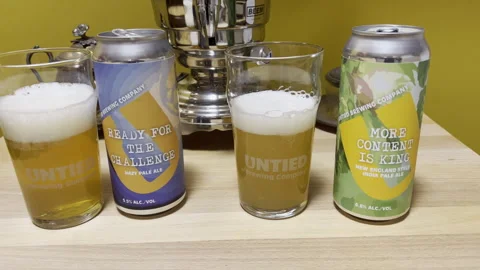 Berkeley Heights, NJ, USA - 02-14-2022: craft IPA beer cans and glasses Stock Footage 344814744