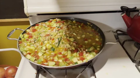 Berkeley Heights, NJ, USA - 02-15-2022:  pan of mixed vegetables and beans cooki Stock Footage 344814832