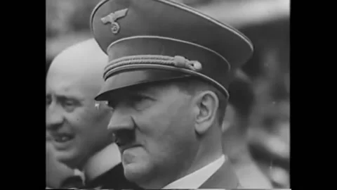 BERLIN - 1936 - German Olympians throw the Nazi salute to Adolf Hitler as they Stock Footage 272361748