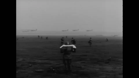 BERLIN - 1945 - Six Douglas C-47 Skytrain airplanes fly over a field, and Stock Footage 264753264