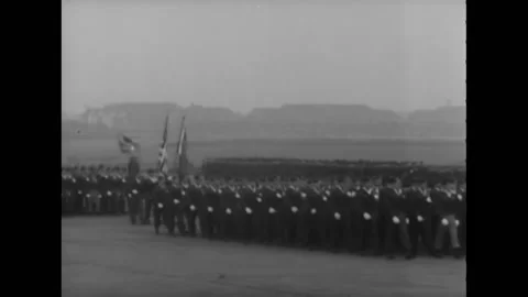 BERLIN - 1945 - Troops march in formation on a runway in Berlin, Germany. Stock Footage 264753174