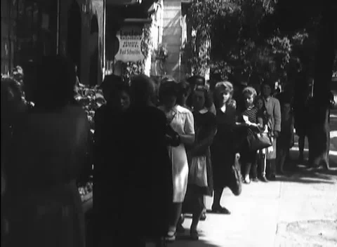 BERLIN - 1946: Bakery queue - Women and children wait outside a shop Stock Footage 344495830