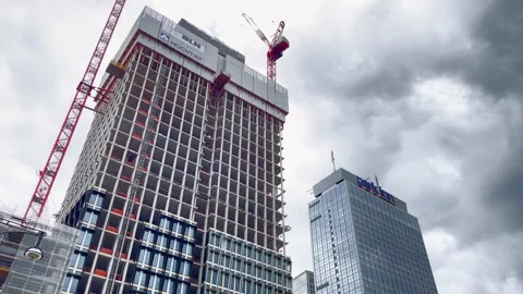 Berlin Alexanderplatz skyscraper construction beneath dramatic storm clouds Stock Footage 341068091