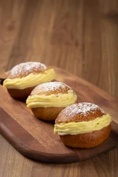 Berlin balls. Bread stuffed with icing cream. Stock Photos