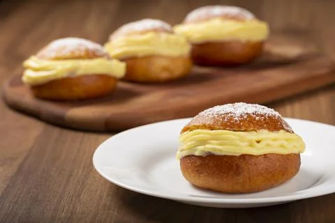 Berlin balls. Bread stuffed with icing cream. Stock Photos