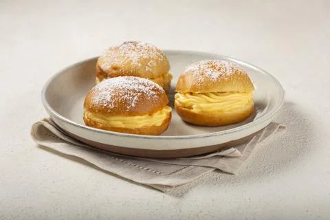 Berlin balls. Bread stuffed with icing cream. Stock Photos