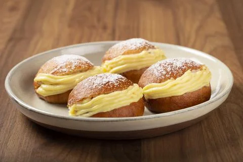 Berlin balls. Bread stuffed with icing cream. Stock Photos
