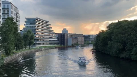 Berlin: Boats on the Spree River between Moabit and Charlottenburg at dusk, 4K Stock Footage 248284456