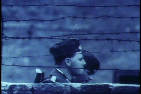 Berlin, B&W Archival, 1961, two soldiers heads passing, close up Stock Footage