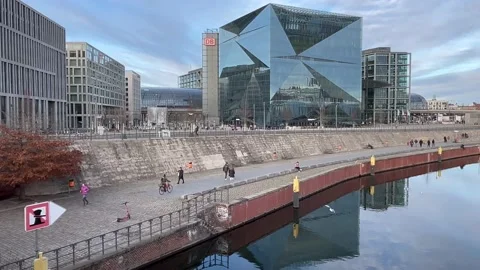 Berlin: Central railway station and futuristic 3XN Cube Berlin building, 4K Stock Footage 169091241
