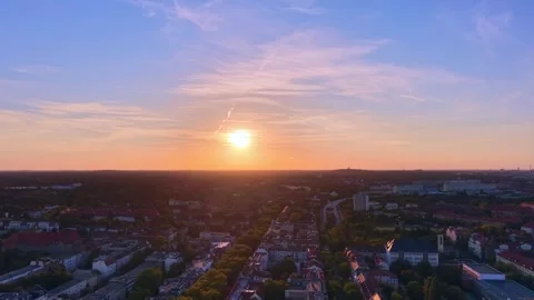 Berlin cityscape at Solar Eclipse golden hour with setting sun. Best aerial Stock Footage 344496567