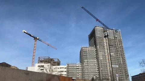 Berlin: Construction cranes at a building site of a high-rise building, 4K Stock Footage 299984966